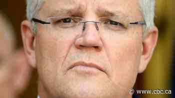 Australian PM apologizes for vacationing as firefighters killed in huge blazes