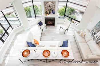 PHOTOS: Two-storey, million-dollar condo sold overlooking Mill Lake