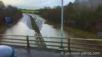 M23 flooded as downpours bring pre-Christmas chaos to roads and rail