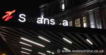 The lit-up sign at Swansea train station has been broken for almost two years and people are annoyed