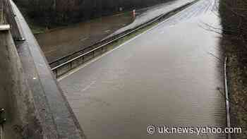 Roads and rail lines flooded as downpours hit Christmas getaway