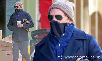 Bradley Cooper bundles up in layers and faces the frigid temperatures in New York for coffee