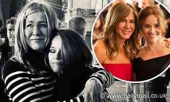 Reese Witherspoon wraps her arms around Jennifer Aniston during last day on set of The Morning Show