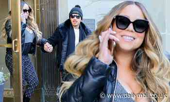 Mariah Carey, 49, flashes a broad smile as she steps out with boyfriend Bryan Tanaka, 36, in NYC
