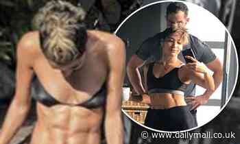 Strictly's Karen Hauer showcases her incredible washboard abs in a TINY black bikini