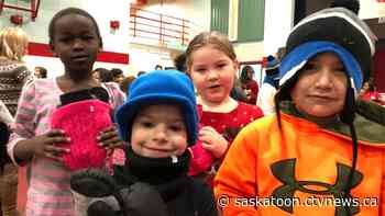 Prince Albert Kinsmen donate winter clothes to kids