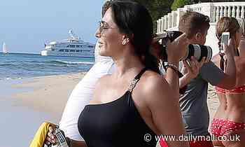 Lauren Silverman stuns in chic one-shoulder swimsuit as Simon Cowell treats son Eric to jet-ski ride