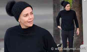 Charlize Theron is a dressed down bombshell in all black athletic wear in Los Angeles