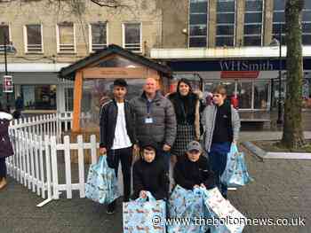 Pupils of Youth Challenge distribute parcels to Bolton's homeless