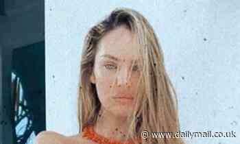 Candice Swanepoel sets pulses racing as she poses topless wearing sheer workout leggings