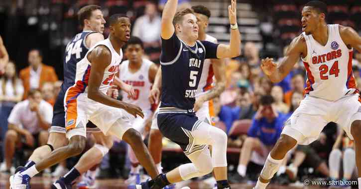 Sam Merrill’s 21 points help Utah State beat Florida 65-62, but Neemias Queta reinjured