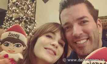 Zooey Deschanel and her boyfriend Jonathan Scott pose with holiday cookies of themselves