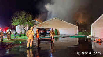 Fire crews battling massive flames at Fresno County home