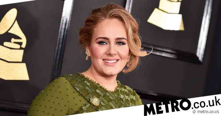 Adele sports glamorous makeover at Christmas party as she poses with the Grinch and Santa