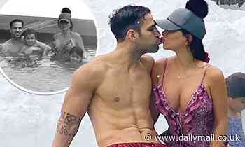 Cesc Fabregas gets a kiss from his wife Daniella Semaan who dons a busty bikini