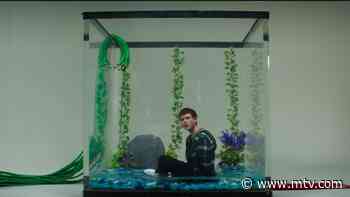 Alec Benjamin Is Chained To A Fishbowl In ‘Mind Is A Prison’