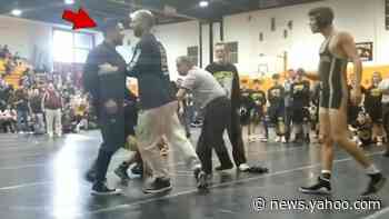Actor Mark Consuelos restrained and pushed away after confronting son's wrestling opponent