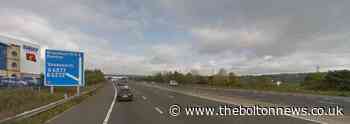 M65 closed in both directions as police try and negotiate with person on bridge