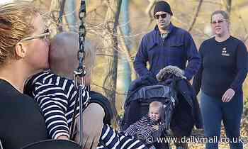Amy Schumer and husband Chris Fischer go for a stroll with their newborn son Gene in Central Park