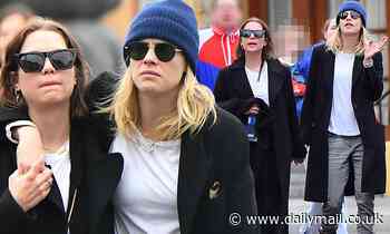 Cara Delevingne keep things casual as she strolls hand in hand with Ashley Benson at Disneyland