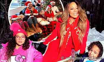 Mariah Carey frolics in snow as stars share Christmas greetings