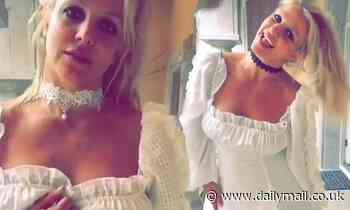 Britney Spears flips ponytail while modeling white form-fitting dress she got for Christmas