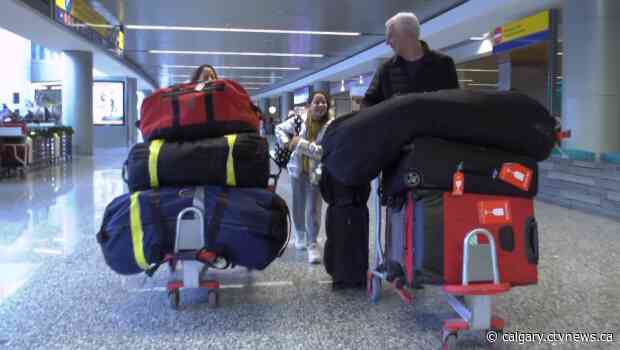 Family, friends, Fidos reunite for Christmas at Calgary airport