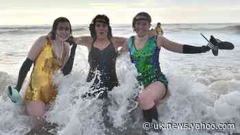 Thousands brave icy seas and lakes for Christmas swims