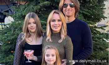 Amanda Holden poses with lookalike daughters Lexy and Hollie and Chris Hughes in Christmas snap 