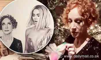 Kathy Griffin rummages through Khloé Kardashian's purse during her family's annual Christmas bash