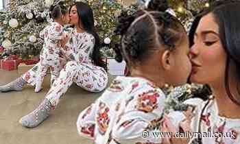 Kylie Jenner shares a sweet kiss with daughter Stormi as they wear matching holiday onesies