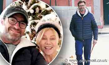 Hugh Jackman walks his dog Allegra in NYC... before wishing Australia merry Christmas with his wife