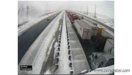 15 Freeway through Cajon Pass closed, heavy snow blankets roadway