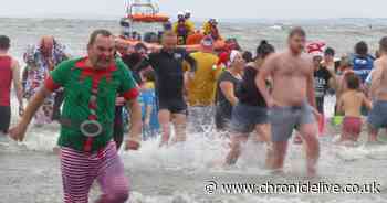 In pictures: Hundreds run off the post-Christmas slump by plunging into the North Sea in Newbiggin