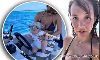 Myleene Klass sizzles in plunging bikini as she takes baby son Apollo for ocean dip in Maldives