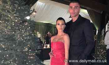 Kourtney Kardashian poses with Younes Bendjima at her Christmas party