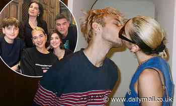 Dua Lipa passionately kisses boyfriend Anwar Hadid before posing with her family
