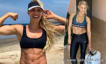 Tiffiny Hall flaunts her rippling torso in a tiny black bikini