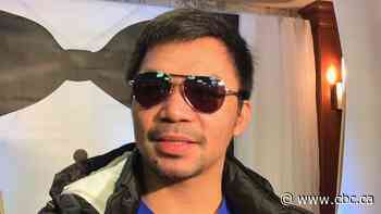 Manny Pacquiao swarmed by fans at Calgary airport during 1st Canadian visit