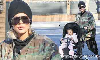 Khloe Kardashian stays warm in a camouflage jacket on a morning run to the farmers' market with True