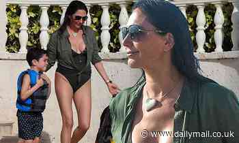 Lauren Silverman puts on a busty display as she joins Simon Cowell and son Eric in Barbados