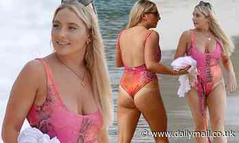 Strictly's Saffron Barker showcases her ample cleavage and pert derriere in pink thong swimsuit