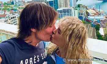 Nicole Kidman embraces her natural curls as she kisses Keith Urban in Sydney