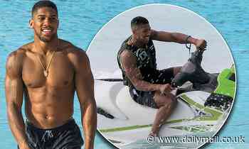 Anthony Joshua goes jet skiing in Barbados during festive break... weeks after huge boxing victory