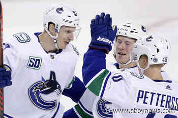 Myers scores 2 as Canucks thump Flames 5-2 for fifth straight win