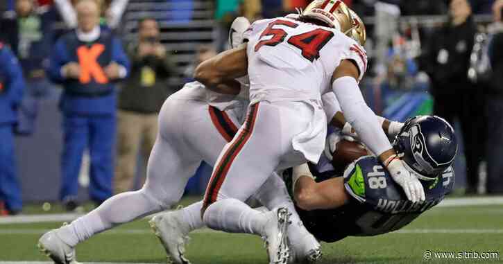 NFL roundup: 49ers stop Seahawks at goal line to win NFC West, claim top seed; Dolphins stun Patriots, denying New England a bye