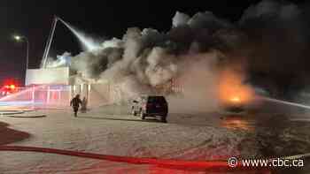 Crews battle early morning fire at Edson Honda dealership