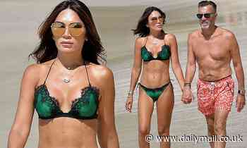 Duncan Bannatyne and bikini-clad Nigora on Barbados beach