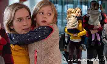 Emily Blunt and John Krasinski jet out of London with their daughters Hazel and Violet