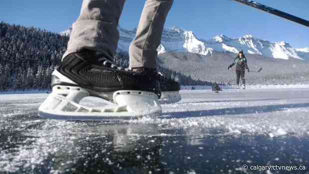 Lake Minnewanka skaters soak in clear conditions on mountain ice